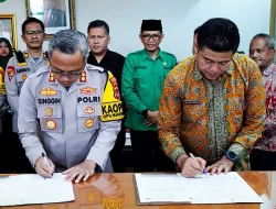 Pjs. Bupati Tandatangani NPHD Hibah Pengamanan Pilkada dengan Polres Batanghari