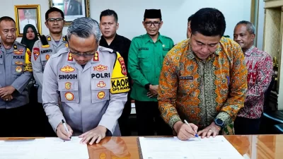 Pjs. Bupati Tandatangani NPHD Hibah Pengamanan Pilkada dengan Polres Batanghari